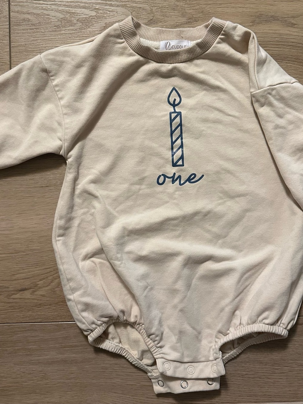 Cream Birthday Candle Graphic Baby One-Piece